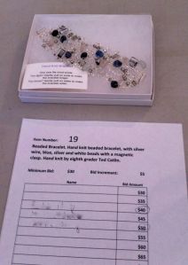 Photo of bracelet with the silent auction sheet